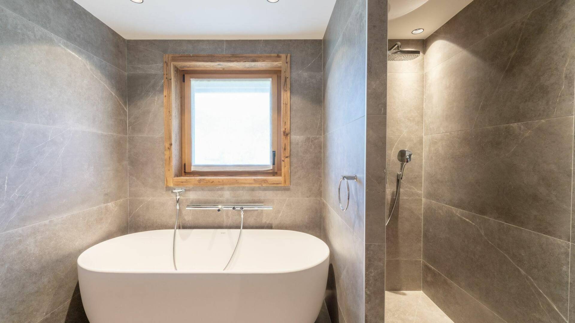 en suite bathroom with bath tub and walk-in shower
