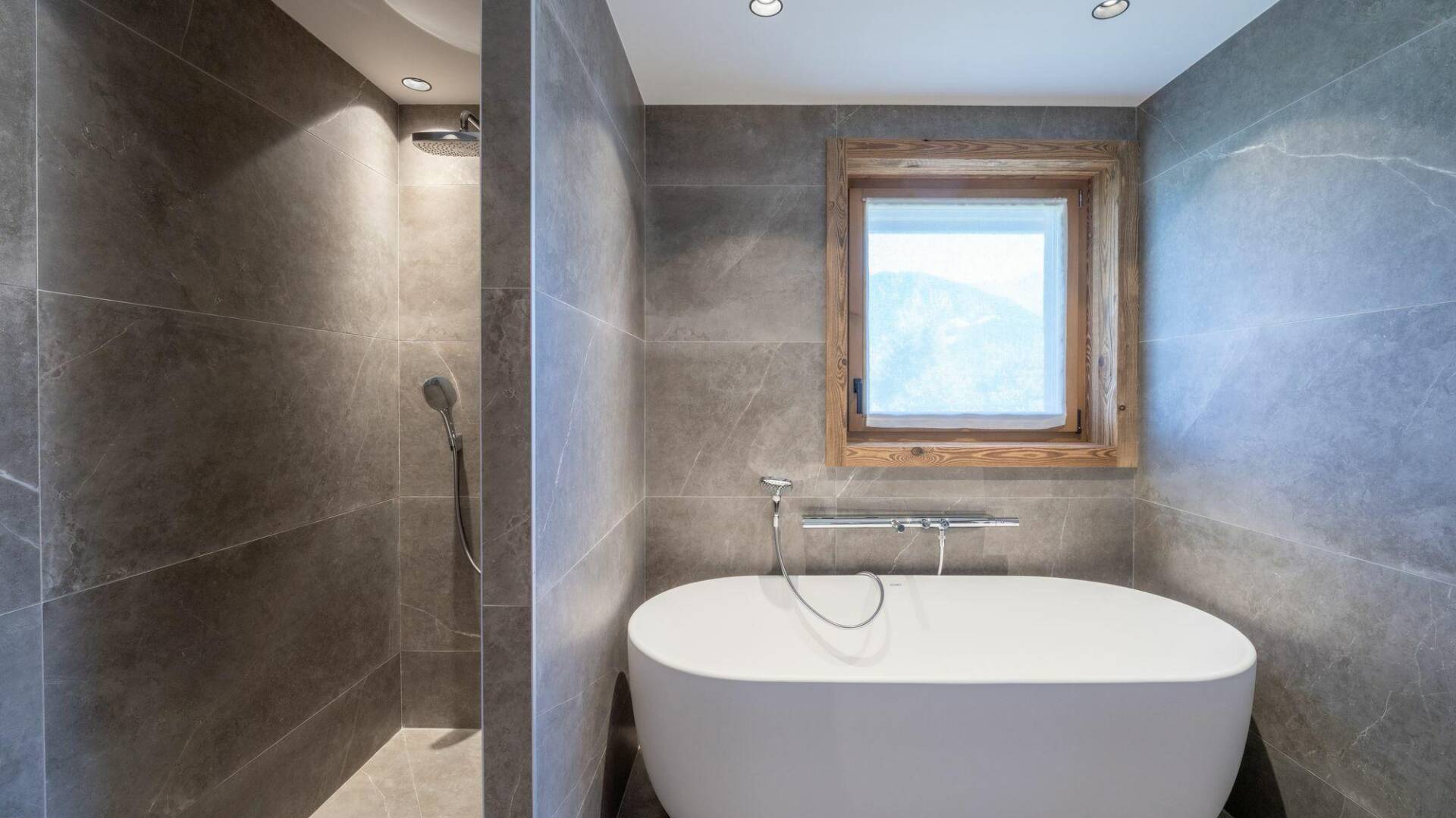 en suite bathroom with walk-in shower and bath tub