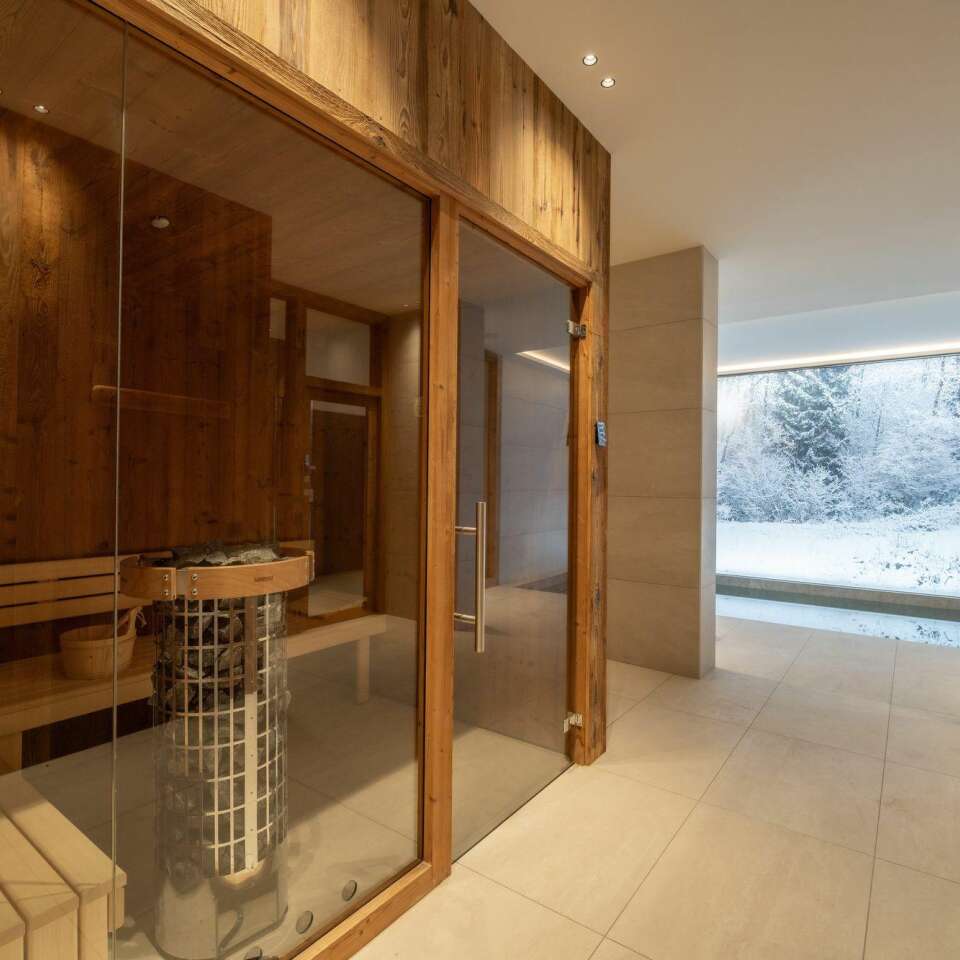private wellness area with sauna and indoor pool