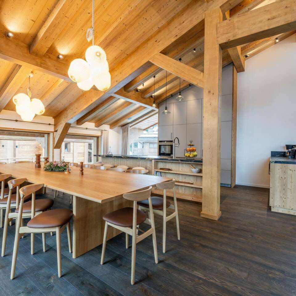 fully-equipped gourmet kitchen and dining table