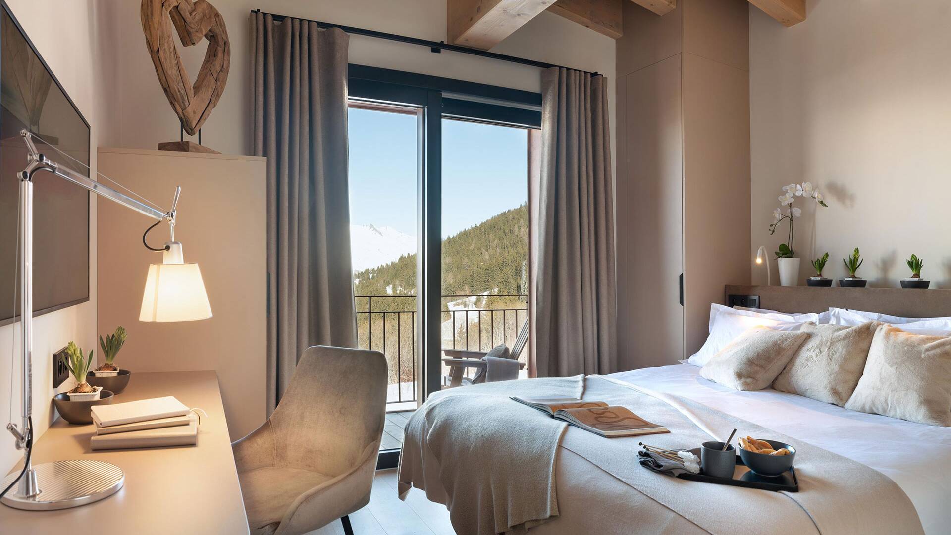 double bedroom with TV and access to balcony