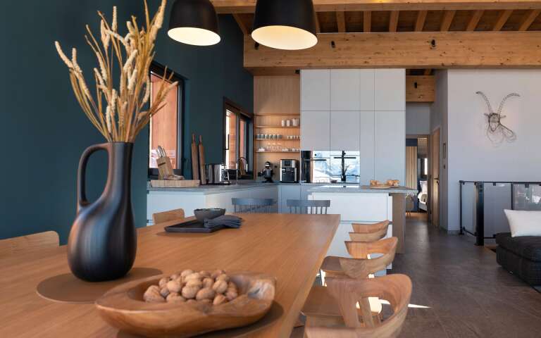 minimal dining area with wooden table
