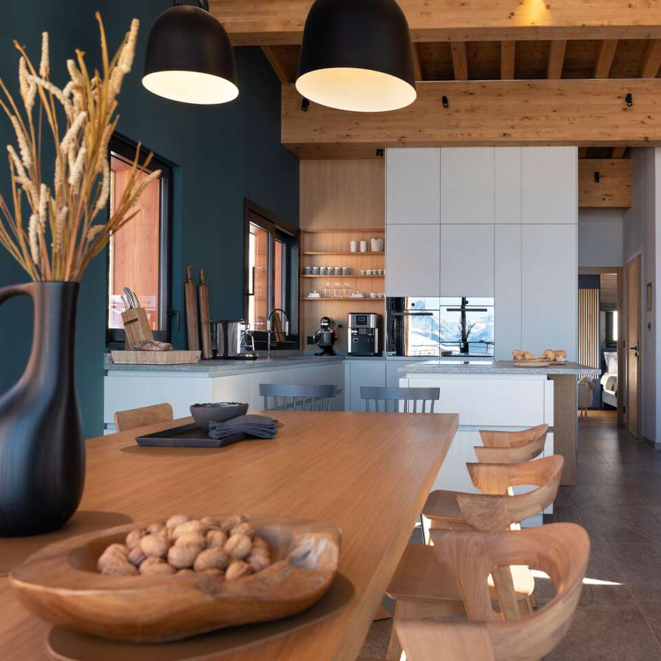 minimal dining area with wooden table