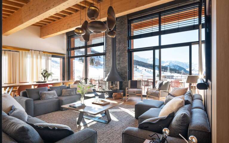 contemporary living room with French windows and fireplace