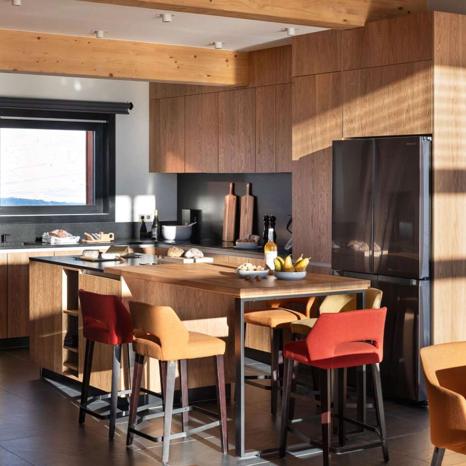 gourmet kitchen with cooking island and stools